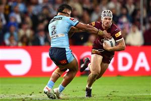BRISBANE, AUSTRALIA - JULY 13: Kalyn Ponga of the Maroonsis tackled during game three of the State of Origin Series between the Queensland Maroons and the New South Wales Blues at Suncorp Stadium on July 13, 2022, in Brisbane, Australia. (Photo by Chris Hyde/Getty Images)