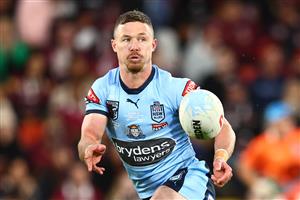 BRISBANE, AUSTRALIA - JULY 13: Damian Cook of the Blues offloads the ball during game three of the State of Origin Series between the Queensland Maroons and the New South Wales Blues at Suncorp Stadium on July 13, 2022, in Brisbane, Australia. (Photo by Chris Hyde/Getty Images)