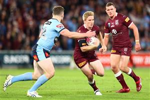 BRISBANE, AUSTRALIA - JULY 13: Tom Dearden of the Maroons is tackled during game three of the State of Origin Series between the Queensland Maroons and the New South Wales Blues at Suncorp Stadium on July 13, 2022, in Brisbane, Australia. (Photo by Chris Hyde/Getty Images)