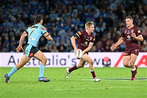 BRISBANE, AUSTRALIA - JULY 13: Tom Dearden of the Maroons looks to pass during game three of the State of Origin Series between the Queensland Maroons and the New South Wales Blues at Suncorp Stadium on July 13, 2022 in Brisbane, Australia. (Photo by Bradley Kanaris/Getty Images)