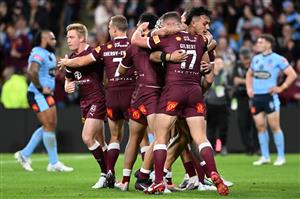 BRISBANE, AUSTRALIA - JULY 13: Valentine Holmes of the Maroons celebrates scoring a try with teammates during game three of the State of Origin Series between the Queensland Maroons and the New South Wales Blues at Suncorp Stadium on July 13, 2022 in Brisbane, Australia. (Photo by Bradley Kanaris/Getty Images)