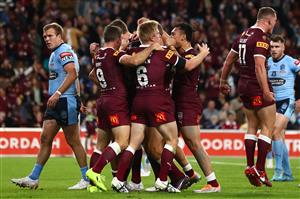 BRISBANE, AUSTRALIA - JULY 13: Valentine Holmes of the Maroons celebrates with team mates after scoring a try during game three of the State of Origin Series between the Queensland Maroons and the New South Wales Blues at Suncorp Stadium on July 13, 2022, in Brisbane, Australia. (Photo by Chris Hyde/Getty Images)