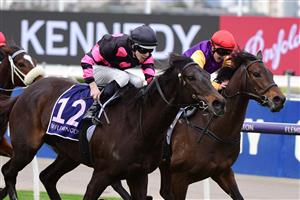 MELBOURNE, AUSTRALIA - JULY 16: Jacob Opperman riding It's True to win Race 3 during Melbourne Racing at Flemington Racecourse on July 16, 2022 in Melbourne, Australia. (Photo by Vince Caligiuri/Getty Images)