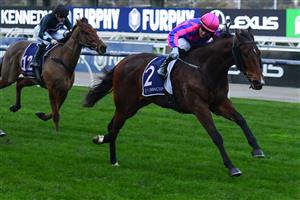 MELBOURNE, AUSTRALIA - JULY 16: Daniel Stackhouse riding Nicolini Vito winning Race 9, the L.v Lachal Handicap, during Melbourne Racing at Flemington Racecourse on July 16, 2022 in Melbourne, Australia. (Photo by Vince Caligiuri/Getty Images)