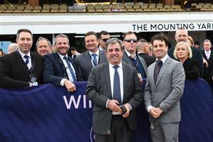 MELBOURNE, AUSTRALIA - JULY 16: Trainer Mark Kavanagh and Levi Kavanagh pose with connections after Horrifying won Race 4, the Flemington Cup 1849, during Melbourne Racing at Flemington Racecourse on July 16, 2022 in Melbourne, Australia. (Photo by Vince Caligiuri/Getty Images)
