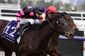 MELBOURNE, AUSTRALIA - JULY 16: Jacob Opperman riding It's True to win Race 3 during Melbourne Racing at Flemington Racecourse on July 16, 2022 in Melbourne, Australia. (Photo by Vince Caligiuri/Getty Images)