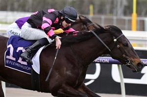 MELBOURNE, AUSTRALIA - JULY 16: Jacob Opperman riding It's True to win Race 3 during Melbourne Racing at Flemington Racecourse on July 16, 2022 in Melbourne, Australia. (Photo by Vince Caligiuri/Getty Images)