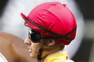 SYDNEY, AUSTRALIA - JULY 16: Jason Collett on Caesars Palace returns to scale after winning race 8 the Tab Handicap during Sydney Racing at Rosehill Gardens on July 16, 2022 in Sydney, Australia. (Photo by Jenny Evans/Getty Images)
