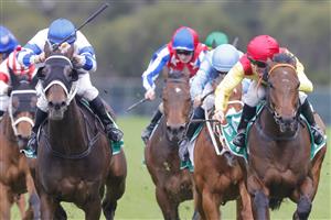 SYDNEY, AUSTRALIA - JULY 16: Jason Collett (red cap) on Caesars Palace wins race 8 the Tab Handicap during Sydney Racing at Rosehill Gardens on July 16, 2022 in Sydney, Australia. (Photo by Jenny Evans/Getty Images)