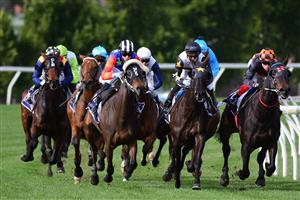 MELBOURNE, AUSTRALIA - JULY 16: Craig Williams riding Horrifying (r) winning Race 4, the Flemington Cup 1849, during Melbourne Racing at Flemington Racecourse on July 16, 2022 in Melbourne, Australia. (Photo by Vince Caligiuri/Getty Images)