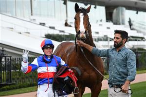 MELBOURNE, AUSTRALIA - JULY 16: Craig Williams after riding Squid Game to win Race 6, the Sir Eugene Gorman Handicap, during Melbourne Racing at Flemington Racecourse on July 16, 2022 in Melbourne, Australia. (Photo by Vince Caligiuri/Getty Images)