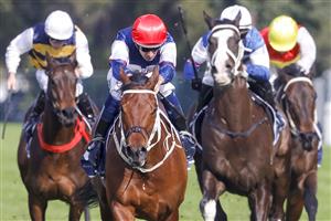 SYDNEY, AUSTRALIA - JULY 16: Hugh Bowman (red cap) on Lord Ardmore wins race 5 the Vale Nick Moraitis Handicap during Sydney Racing at Rosehill Gardens on July 16, 2022 in Sydney, Australia. (Photo by Jenny Evans/Getty Images)