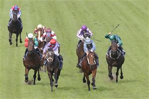 SYDNEY, AUSTRALIA - JULY 16: Hugh Bowman (tartan) on Flag Of Honour wins race 1 the Furphy Handicap during Sydney Racing at Rosehill Gardens on July 16, 2022 in Sydney, Australia. (Photo by Jenny Evans/Getty Images)