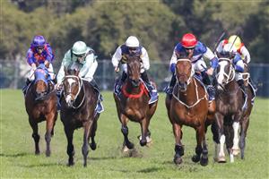 SYDNEY, AUSTRALIA - JULY 16: Hugh Bowman (red cap) on Lord Ardmore wins race 5 the Vale Nick Moraitis Handicap during Sydney Racing at Rosehill Gardens on July 16, 2022 in Sydney, Australia. (Photo by Jenny Evans/Getty Images)