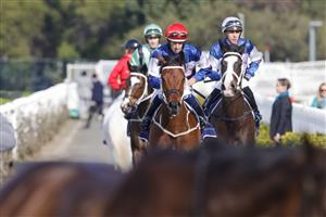 SYDNEY, AUSTRALIA - JULY 16: Hugh Bowman on Lord Ardmore returns to scale after winning race 5 the Vale Nick Moraitis Handicap during Sydney Racing at Rosehill Gardens on July 16, 2022 in Sydney, Australia. (Photo by Jenny Evans/Getty Images)