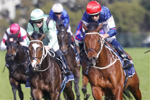 SYDNEY, AUSTRALIA - JULY 16: Hugh Bowman (red cap) on Lord Ardmore wins race 5 the Vale Nick Moraitis Handicap during Sydney Racing at Rosehill Gardens on July 16, 2022 in Sydney, Australia. (Photo by Jenny Evans/Getty Images)