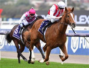 MELBOURNE, AUSTRALIA - JULY 16: Matthew Cartwright riding Giga Kick winning Race 1, the Trevor Clarke Handicap, during Melbourne Racing at Flemington Racecourse on July 16, 2022 in Melbourne, Australia. (Photo by Vince Caligiuri/Getty Images)