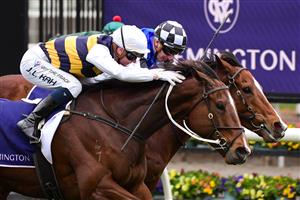 MELBOURNE, AUSTRALIA - JULY 16: Jamie Kah riding Hezashocka defeats Matthew Cartwright riding Mankayan in Race 7, the Vrc Members Handicap, during Melbourne Racing at Flemington Racecourse on July 16, 2022 in Melbourne, Australia. (Photo by Vince Caligiuri/Getty Images)