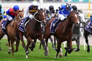 MELBOURNE, AUSTRALIA - JULY 16: Jamie Kah riding Hezashocka defeats Matthew Cartwright riding Mankayan in Race 7, the Vrc Members Handicap, during Melbourne Racing at Flemington Racecourse on July 16, 2022 in Melbourne, Australia. (Photo by Vince Caligiuri/Getty Images)
