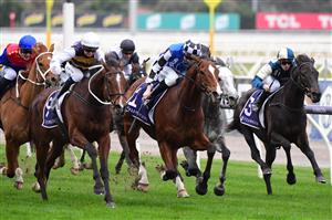 MELBOURNE, AUSTRALIA - JULY 16: Jamie Kah riding Hezashocka defeats Matthew Cartwright riding Mankayan in Race 7, the Vrc Members Handicap, during Melbourne Racing at Flemington Racecourse on July 16, 2022 in Melbourne, Australia. (Photo by Vince Caligiuri/Getty Images)