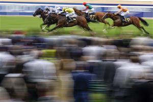 ASCOT, ENGLAND - JULY 23: Daniel Tudhope riding Fresh (L, grey) win The Moet & Chandon International Stakes at Ascot Racecourse on July 23, 2022 in Ascot, England. (Photo by Alan Crowhurst/Getty Images)