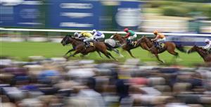 ASCOT, ENGLAND - JULY 23: Daniel Tudhope riding Fresh (L, grey) win The Moet & Chandon International Stakes at Ascot Racecourse on July 23, 2022 in Ascot, England. (Photo by Alan Crowhurst/Getty Images)