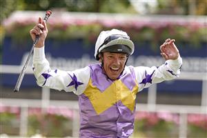 ASCOT, ENGLAND - JULY 23: Frankie Dettori leaps from his mount after riding Lezoo to win The Princess Margaret Keeneland Stakes at Ascot Racecourse on July 23, 2022 in Ascot, England. (Photo by Alan Crowhurst/Getty Images)