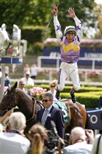 ASCOT, ENGLAND - JULY 23: Frankie Dettori leaps from his mount after riding Lezoo to win The Princess Margaret Keeneland Stakes at Ascot Racecourse on July 23, 2022 in Ascot, England. (Photo by Alan Crowhurst/Getty Images)