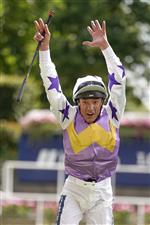 ASCOT, ENGLAND - JULY 23: Frankie Dettori leaps from his mount after riding Lezoo to win The Princess Margaret Keeneland Stakes at Ascot Racecourse on July 23, 2022 in Ascot, England. (Photo by Alan Crowhurst/Getty Images)
