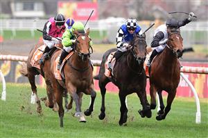 MELBOURNE, AUSTRALIA - JULY 23: Will Price riding Thron Bone winning Race 1, the Mrc Membership Renewal Handicap, during Melbourne Racing at Caulfield Racecourse on July 23, 2022 in Melbourne, Australia. (Photo by Vince Caligiuri/Getty Images)