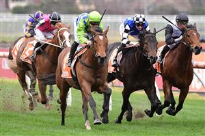 MELBOURNE, AUSTRALIA - JULY 23: Will Price riding Thron Bone winning Race 1, the Mrc Membership Renewal Handicap, during Melbourne Racing at Caulfield Racecourse on July 23, 2022 in Melbourne, Australia. (Photo by Vince Caligiuri/Getty Images)