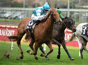 MELBOURNE, AUSTRALIA - JULY 23: Jye McNeil riding Big Apple winning Race 6, the Senet Gambling Law Experts Handicap, during Melbourne Racing at Caulfield Racecourse on July 23, 2022 in Melbourne, Australia. (Photo by Vince Caligiuri/Getty Images)