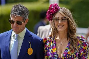 CHICHESTER, ENGLAND - JULY 27: Actress Liz Hurley with friend Henry Birtles during day two of the Qatar Goodwood Festival at Goodwood Racecourse on July 27, 2022 in Chichester, England. (Photo by Alan Crowhurst/Getty Images)