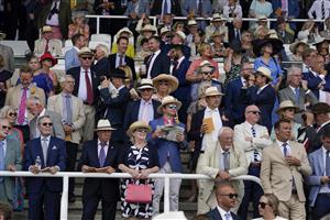 CHICHESTER, ENGLAND - JULY 27: Racegoers during day two of the Qatar Goodwood Festival at Goodwood Racecourse on July 27, 2022 in Chichester, England. (Photo by Alan Crowhurst/Getty Images)