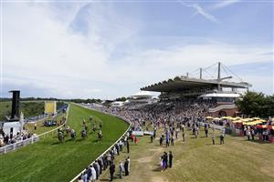CHICHESTER, ENGLAND - JULY 27: William Buick riding Secret State (blue) ease down after winning The Coral Beaten-By-A-Length Free Bet Handicap during day two of the Qatar Goodwood Festival at Goodwood Racecourse on July 27, 2022 in Chichester, England. (Photo by Alan Crowhurst/Getty Images)