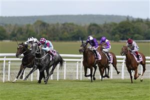 CHICHESTER, ENGLAND - JULY 27: William Buick riding Oscula (L, white) win The Whispering Angel Oak Tree Stakes during day two of the Qatar Goodwood Festival at Goodwood Racecourse on July 27, 2022 in Chichester, England. (Photo by Alan Crowhurst/Getty Images)
