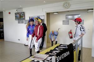CHICHESTER, ENGLAND - JULY 28: Adam Kirby 9red) shares a joke with Rab Havlin (purple) during day three of the Qatar Goodwood Festival at Goodwood Racecourse on July 28, 2022 in Chichester, England. (Photo by Alan Crowhurst/Getty Images)