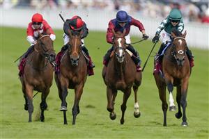 CHICHESTER, ENGLAND - JULY 28: Hollie Doyle riding Nashwa (green) win The Qatar Nassau Stakes during day three of the Qatar Goodwood Festival at Goodwood Racecourse on July 28, 2022 in Chichester, England. (Photo by Alan Crowhurst/Getty Images)