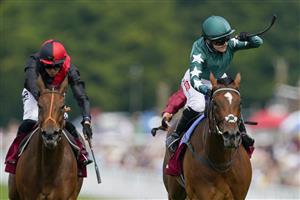 CHICHESTER, ENGLAND - JULY 28: Hollie Doyle riding Nashwa (green) win The Qatar Nassau Stakes during day three of the Qatar Goodwood Festival at Goodwood Racecourse on July 28, 2022 in Chichester, England. (Photo by Alan Crowhurst/Getty Images)