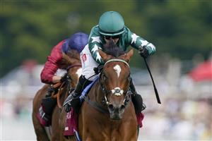 CHICHESTER, ENGLAND - JULY 28: Hollie Doyle riding Nashwa (green) win The Qatar Nassau Stakes during day three of the Qatar Goodwood Festival at Goodwood Racecourse on July 28, 2022 in Chichester, England. (Photo by Alan Crowhurst/Getty Images)