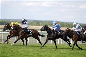 CHICHESTER, ENGLAND - JULY 28: Hollie Doyle riding Prairie Falcon (L, white/blue) win The Jaeger-Lecoultre Nursery during day three of the Qatar Goodwood Festival at Goodwood Racecourse on July 28, 2022 in Chichester, England. (Photo by Alan Crowhurst/Getty Images)