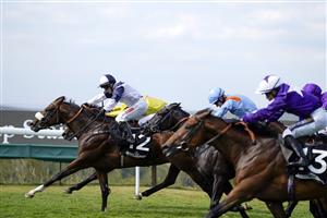 CHICHESTER, ENGLAND - JULY 28: Hollie Doyle riding Prairie Falcon (L, white/blue) win The Jaeger-Lecoultre Nursery during day three of the Qatar Goodwood Festival at Goodwood Racecourse on July 28, 2022 in Chichester, England. (Photo by Alan Crowhurst/Getty Images)