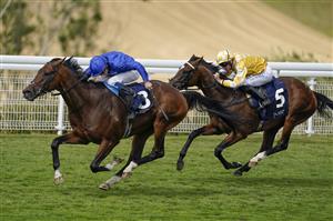 CHICHESTER, ENGLAND - JULY 28: William Buick riding New London (blue) win The John Pearce Racing Gordon Stakes during day three of the Qatar Goodwood Festival at Goodwood Racecourse on July 28, 2022 in Chichester, England. (Photo by Alan Crowhurst/Getty Images)
