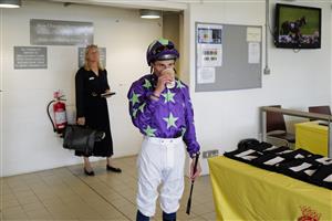 CHICHESTER, ENGLAND - JULY 28: William Buick has a quick drink before race six during day three of the Qatar Goodwood Festival at Goodwood Racecourse on July 28, 2022 in Chichester, England. (Photo by Alan Crowhurst/Getty Images)