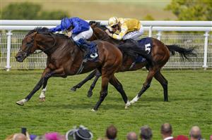 CHICHESTER, ENGLAND - JULY 28: William Buick riding New London (blue) win The John Pearce Racing Gordon Stakes during day three of the Qatar Goodwood Festival at Goodwood Racecourse on July 28, 2022 in Chichester, England. (Photo by Alan Crowhurst/Getty Images)