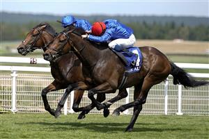 CHICHESTER, ENGLAND - JULY 28: William Buick riding Warren Point (red cap) win The Coral Kincsem Handicap during day three of the Qatar Goodwood Festival at Goodwood Racecourse on July 28, 2022 in Chichester, England. (Photo by Alan Crowhurst/Getty Images)
