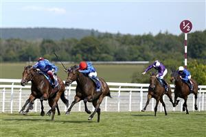 CHICHESTER, ENGLAND - JULY 28: William Buick riding Warren Point (red cap) win The Coral Kincsem Handicap during day three of the Qatar Goodwood Festival at Goodwood Racecourse on July 28, 2022 in Chichester, England. (Photo by Alan Crowhurst/Getty Images)