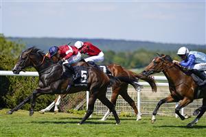 CHICHESTER, ENGLAND - JULY 29: Tom Marquand riding Rocchigiani (L, red/blue cap) win The Bonhams Thoroughbred Stakes during day four of the Qatar Goodwood Festival at Goodwood Racecourse on July 29, 2022 in Chichester, England. (Photo by Alan Crowhurst/Getty Images)