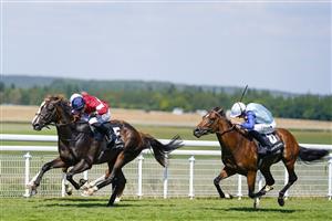 CHICHESTER, ENGLAND - JULY 29: Tom Marquand riding Rocchigiani (L, red/blue cap) win The Bonhams Thoroughbred Stakes during day four of the Qatar Goodwood Festival at Goodwood Racecourse on July 29, 2022 in Chichester, England. (Photo by Alan Crowhurst/Getty Images)
