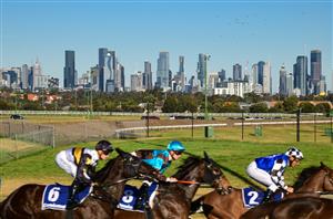 MELBOURNE, AUSTRALIA - JULY 30: General view of the Melbourne skyline as horses are seen in Race 5, the Easy Foam Hand Wash Handicap, during Melbourne Racing at Moonee Valley Racecourse on July 30, 2022 in Melbourne, Australia. (Photo by Vince Caligiuri/Getty Images)